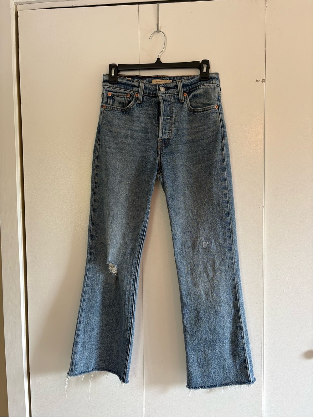 Levi's Premium Medium Wash Boot-Cut Jeans with Distressed Details